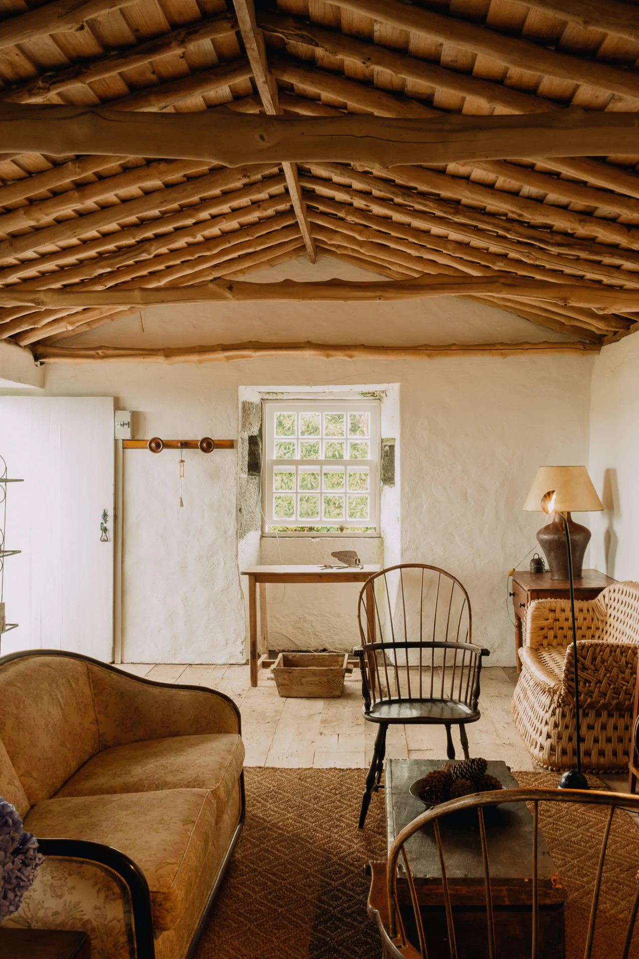 A living room with a wooden ceiling.