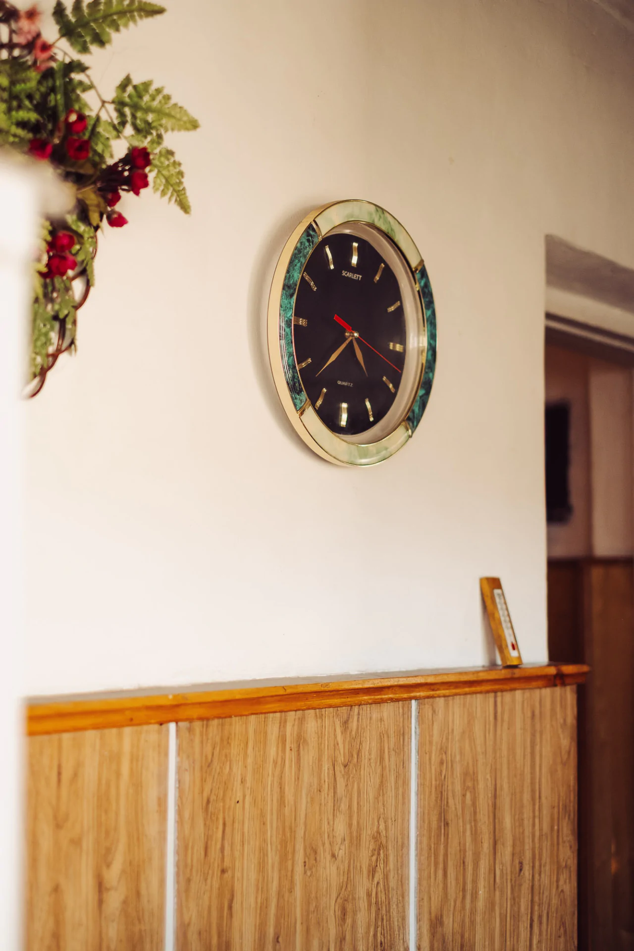 A wooden wall with a clock on it.