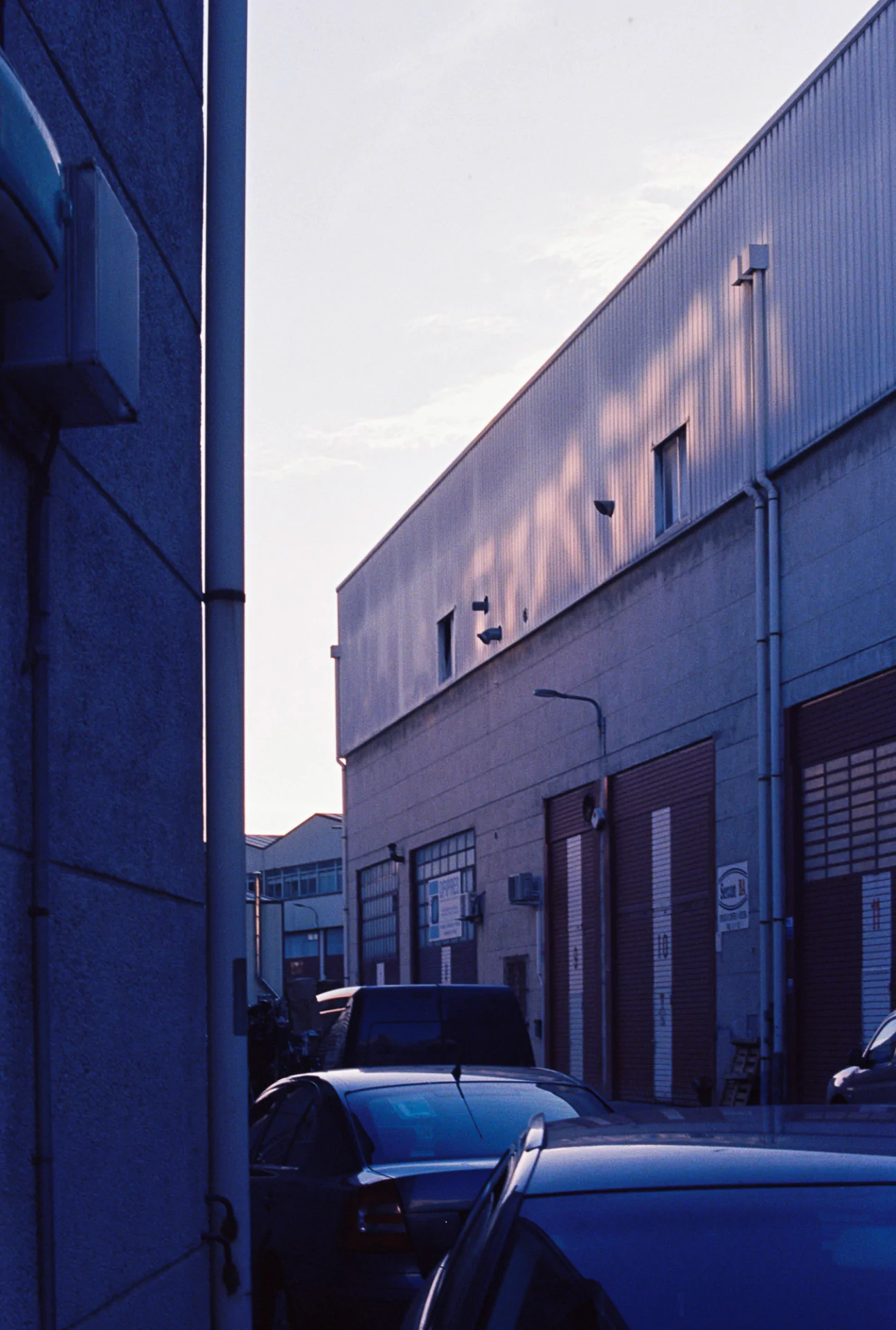 A car parked in front of a building.