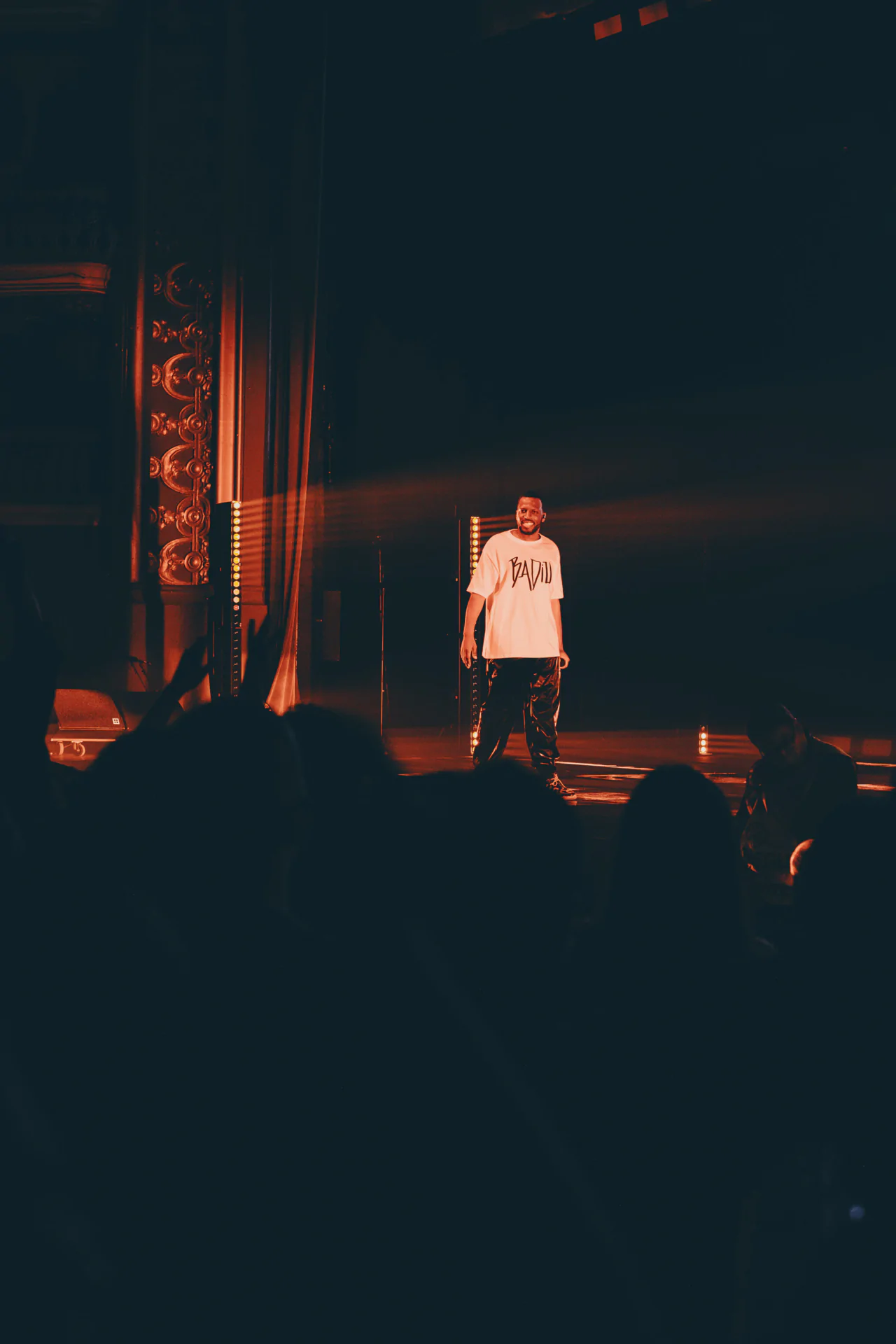 A man standing on stage at a concert.