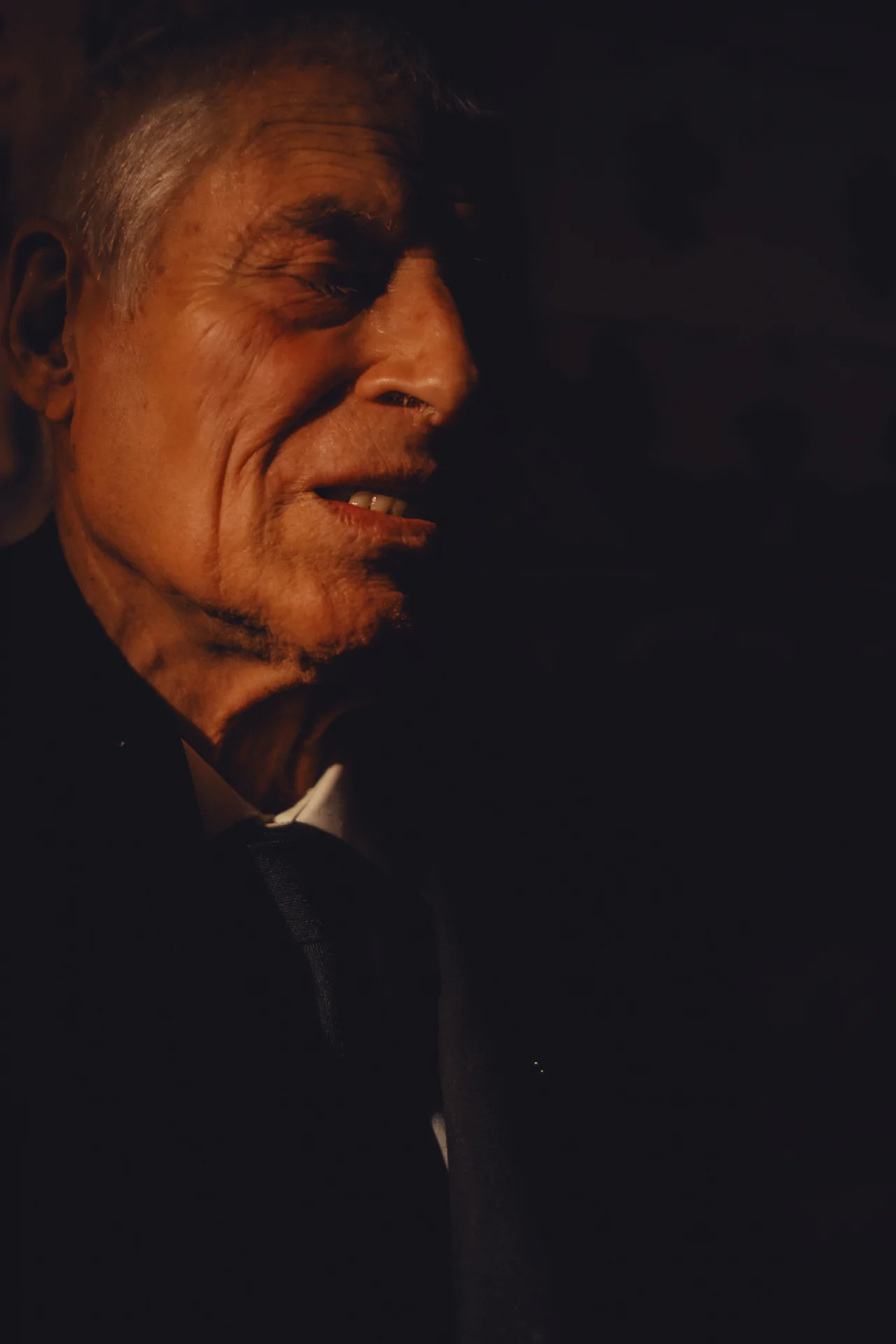 Fado musician portrait in low light traditional Portuguese music venue