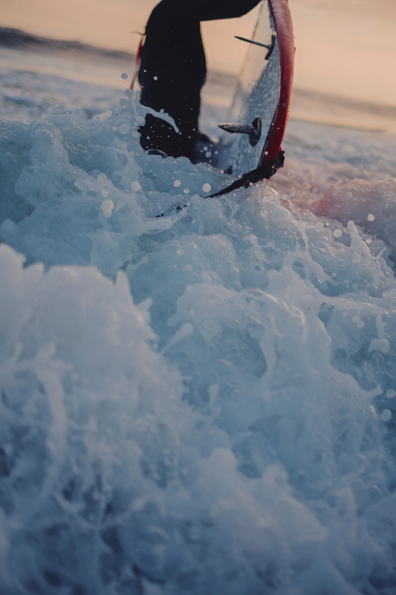 Surfer duck diving underwater with surfboard Atlantic Ocean Portugal