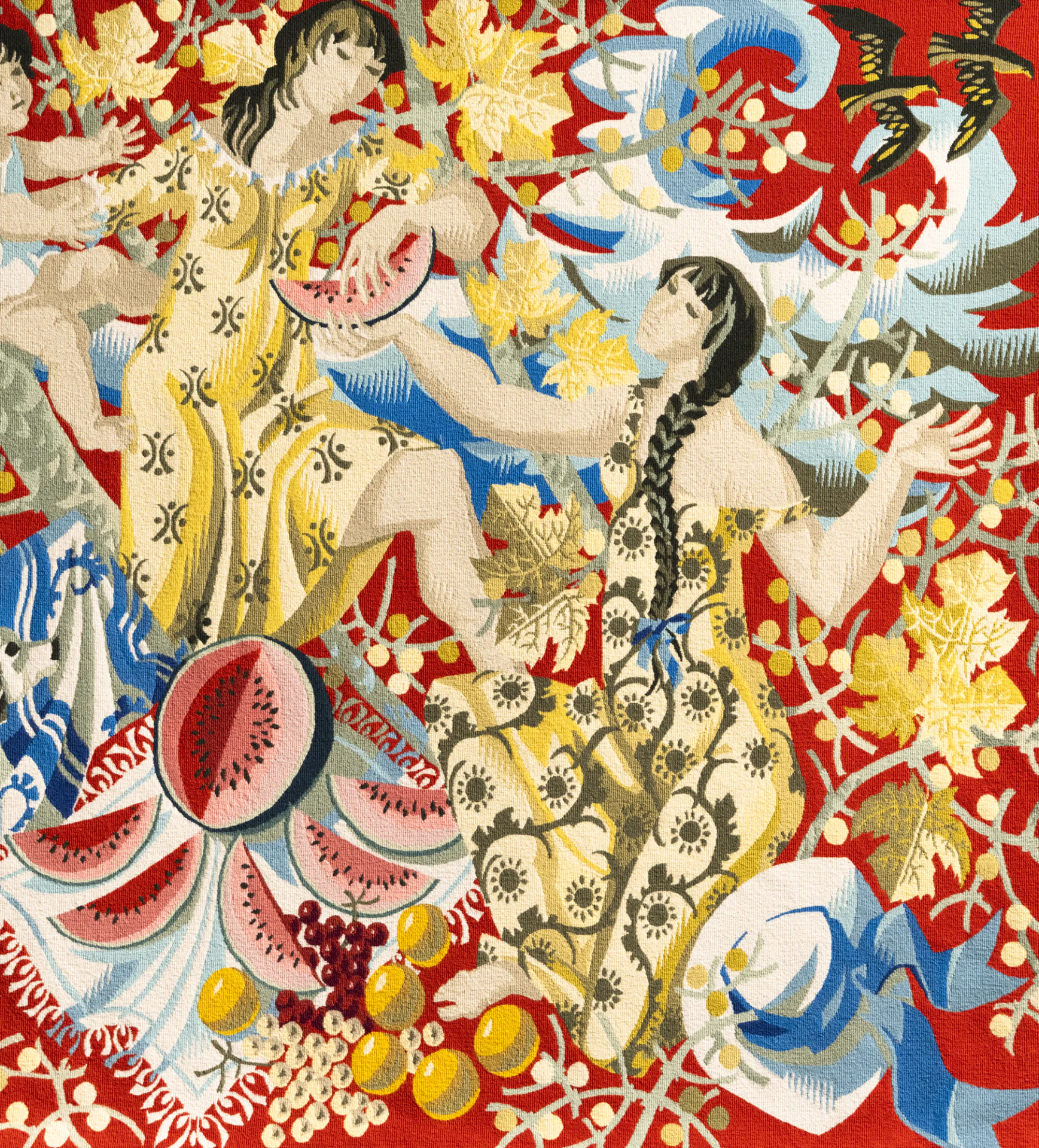Two women in patterned dresses sit among fruit and leaves on a red background, with watermelon, grapes, and birds included in the vibrant scene.